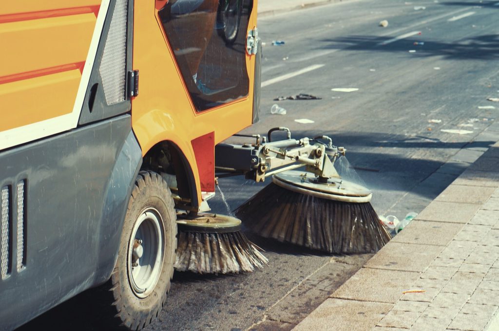 OUTCO Street cleaning machine on the street.